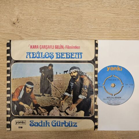 Sadık Gürbüz – Adiloş Bebem / Yolun Sırrın Bilen Gelsin 45LİK PLAK